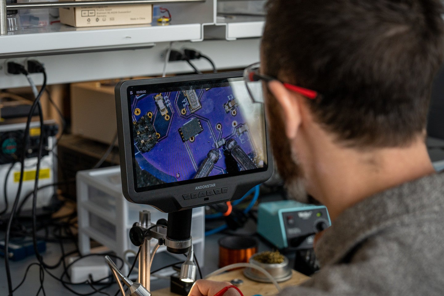 Image of researcher looking at screen in lab