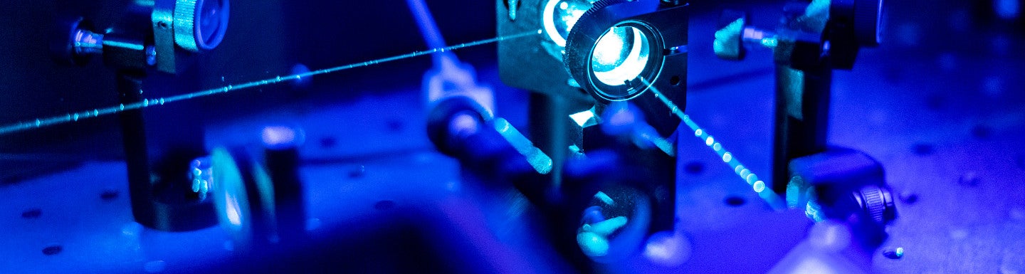 Image of lasers and nonlinear optics with blue and purple tint
